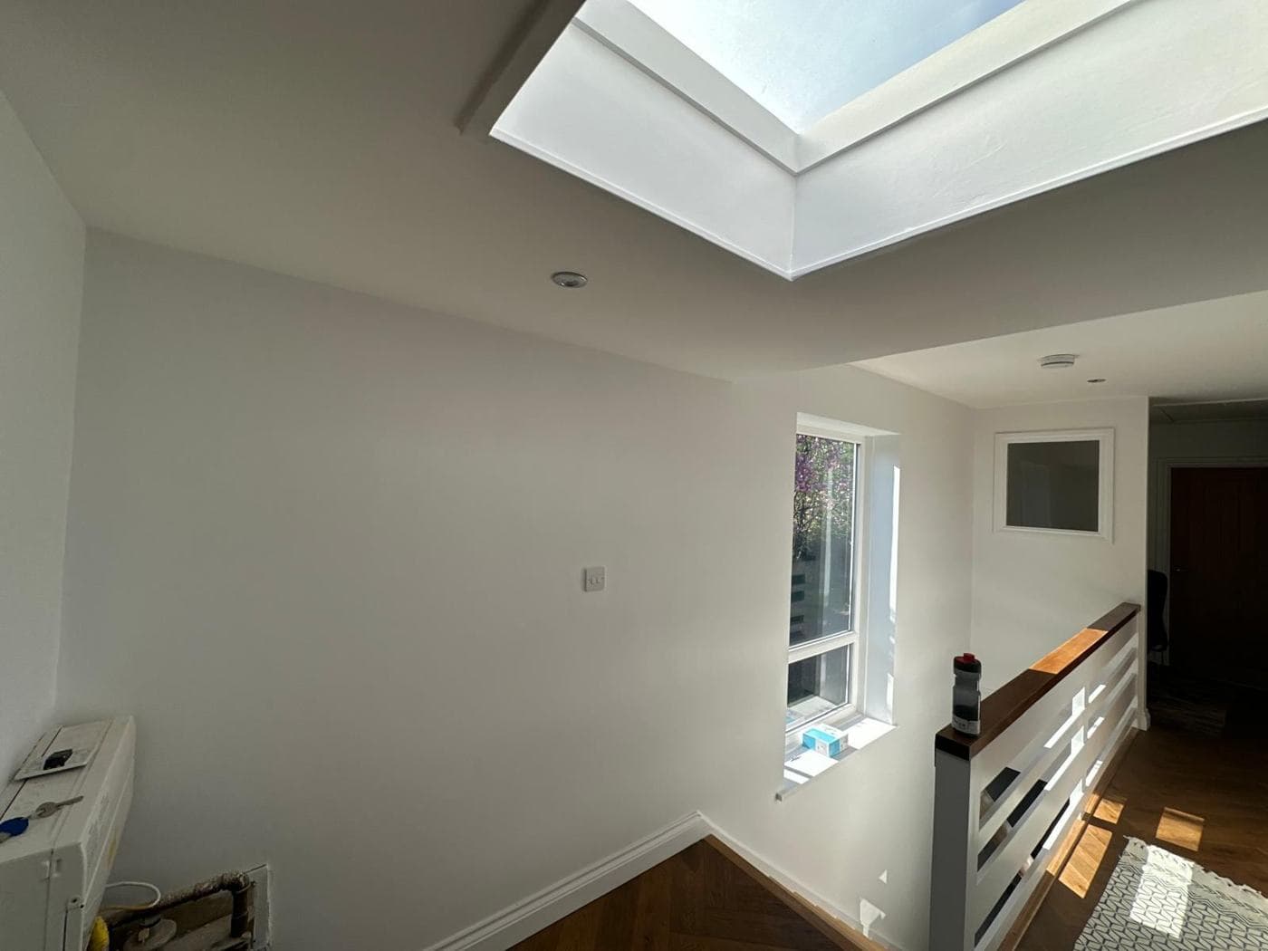 Landing with rooflight and oak-topped balustrade — rcbGroup project